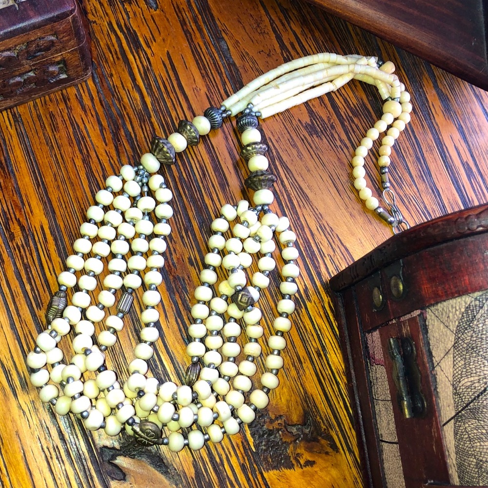 Ivory-colored beaded necklace 29”